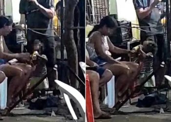Mãe dá bebida alcoólica a criança durante bingo em local público em Barbalha (Foto: Reprodução)
